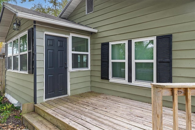 doorway to property featuring a wooden deck