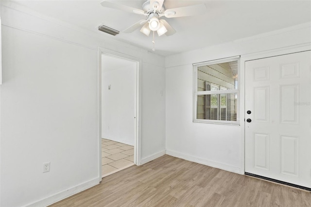 entryway with ceiling fan and light hardwood / wood-style flooring