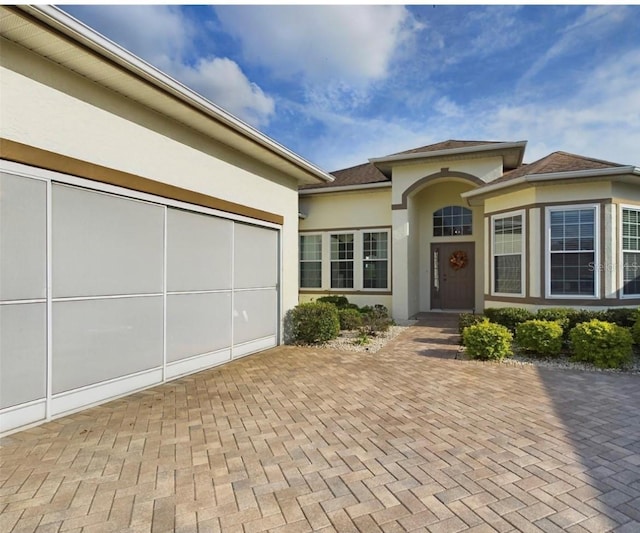 doorway to property featuring a garage