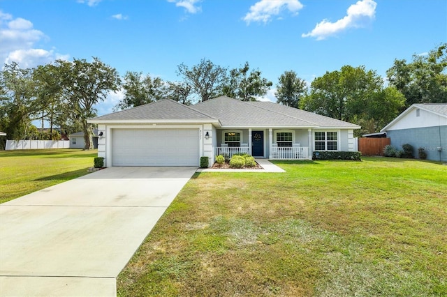 ranch-style house featuring a front lawn, a garage, and a porch