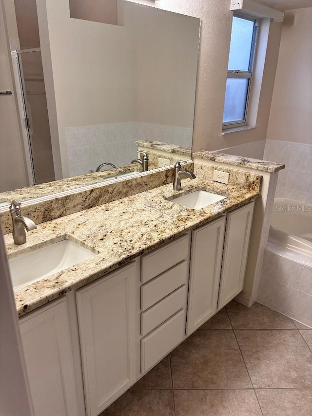 bathroom featuring vanity, separate shower and tub, and tile patterned floors