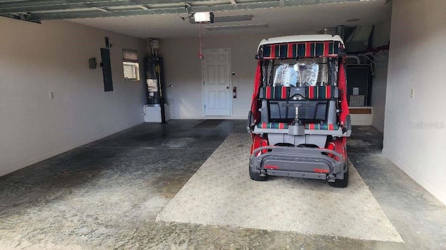 garage featuring a garage door opener, electric panel, and water heater