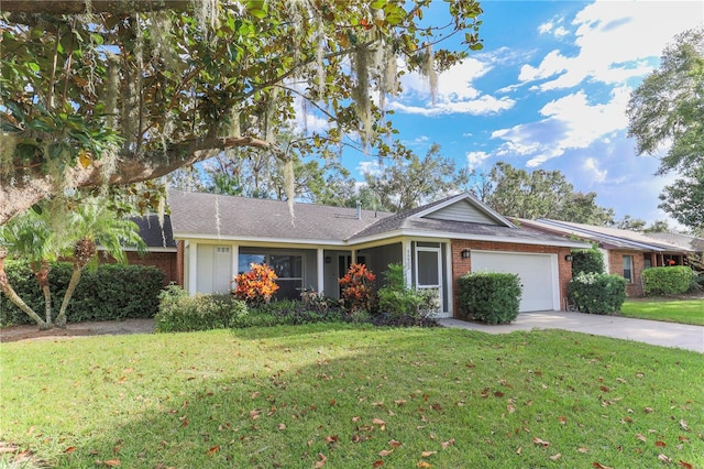 single story home featuring a front lawn and a garage