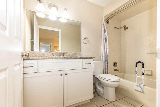 full bathroom featuring tile patterned floors, vanity, shower / bath combo with shower curtain, and toilet