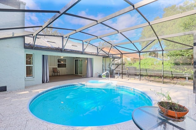 view of swimming pool featuring a patio, a lanai, and ceiling fan