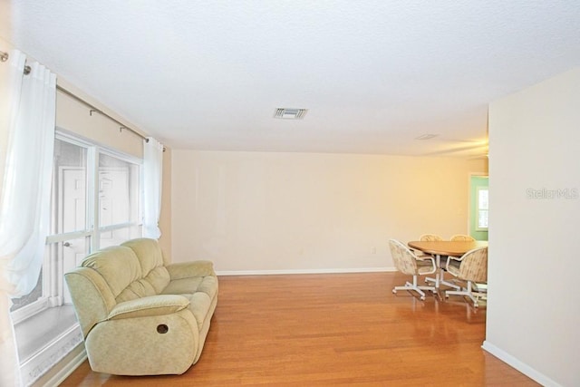 sitting room featuring light hardwood / wood-style floors