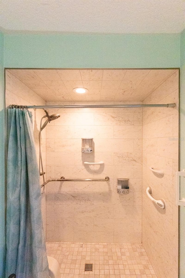 bathroom with a shower with shower curtain