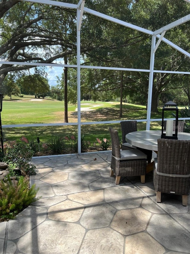 view of patio with a lanai