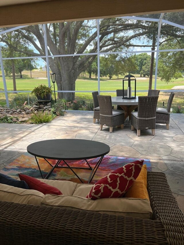 view of patio / terrace with a lanai