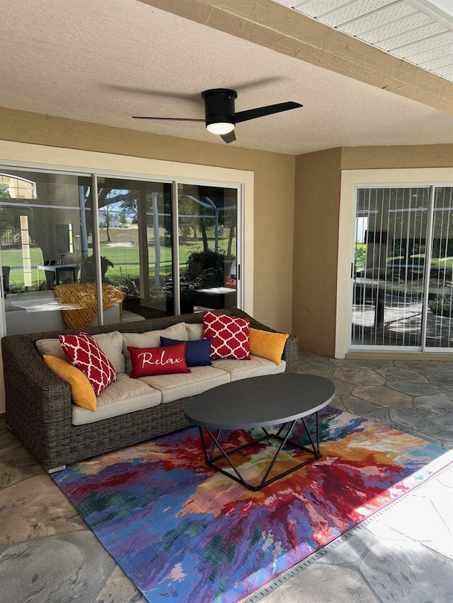 view of patio featuring ceiling fan