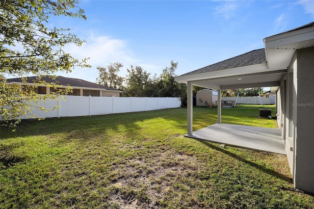 view of yard with a patio and central AC