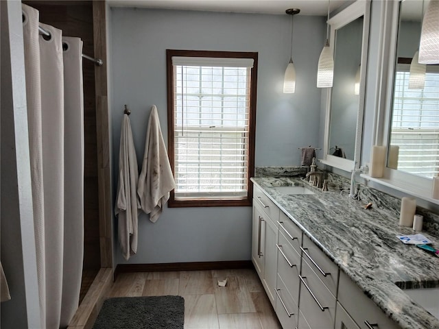 bathroom featuring vanity and hardwood / wood-style flooring