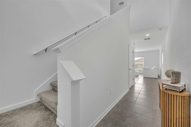 stairs with tile patterned floors