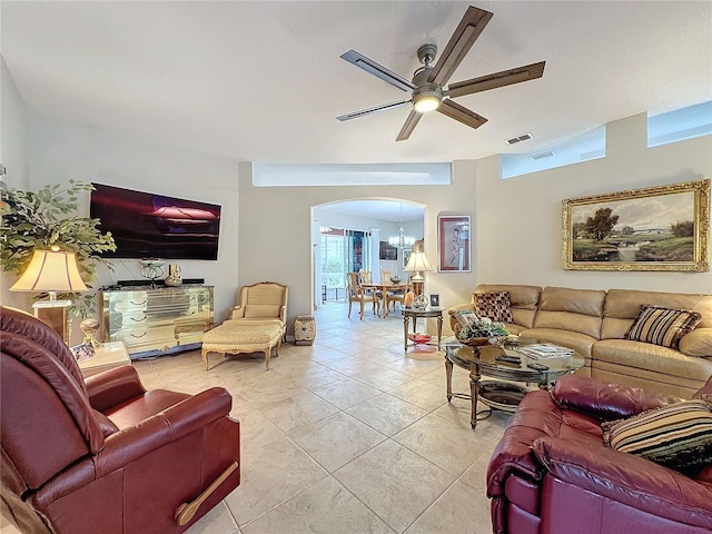 4088 Kingsley St, Clermont, FL 34711 - living room featuring arched walkways, light tile patterned floors, visible vents, and a ceiling fan