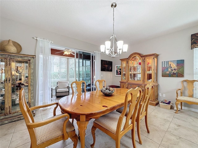 4088 Kingsley St, Clermont, FL 34711 - dining room featuring light tile patterned floors and ceiling fan with notable chandelier