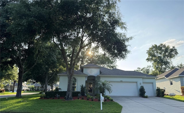 4088 Kingsley St, Clermont, FL 34711 - view of front of property with driveway, stucco siding, a garage, and a front yard