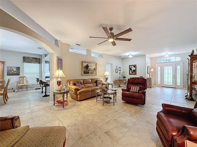 4088 Kingsley St, Clermont, FL 34711 - living room with ceiling fan, visible vents, and arched walkways