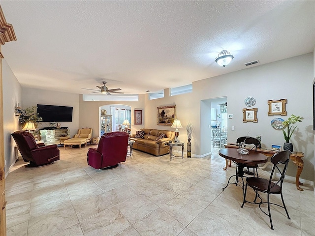 4088 Kingsley St, Clermont, FL 34711 - living area with a textured ceiling, a ceiling fan, and visible vents
