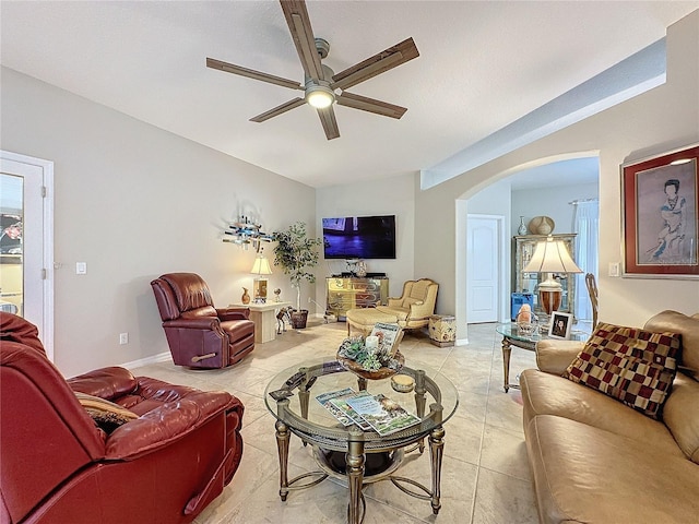 4088 Kingsley St, Clermont, FL 34711 - living area with arched walkways, light tile patterned floors, and ceiling fan