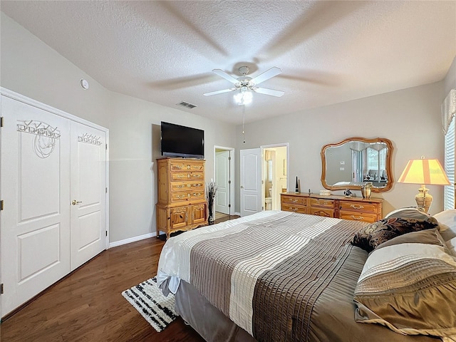 4088 Kingsley St, Clermont, FL 34711 - bedroom with a ceiling fan, a textured ceiling, baseboards, visible vents, and wood finished floors