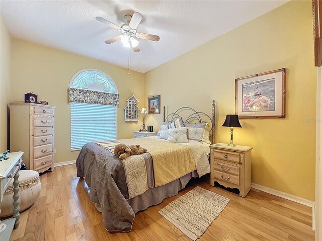4088 Kingsley St, Clermont, FL 34711 - bedroom featuring baseboards, light wood-type flooring, and a ceiling fan