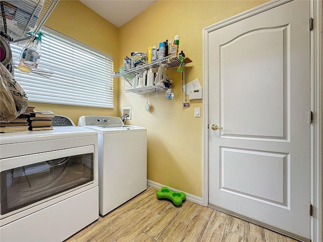 4088 Kingsley St, Clermont, FL 34711 - washroom with laundry area, wood tiled floor, baseboards, and washer and dryer