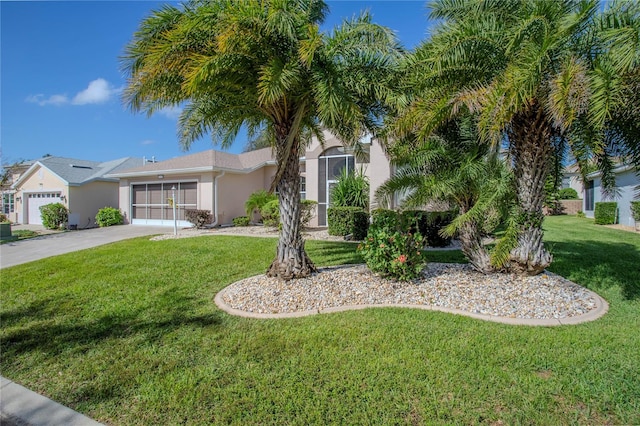 view of front of house featuring a front yard and a garage