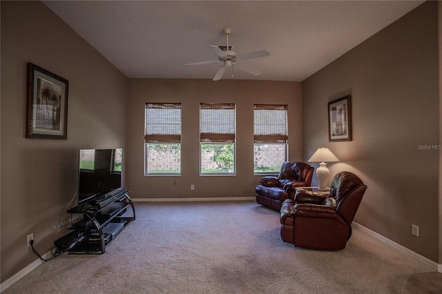 sitting room with carpet floors and plenty of natural light