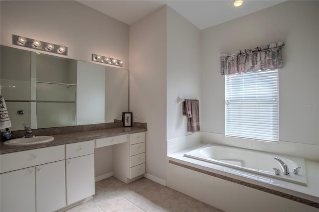 bathroom featuring vanity, shower with separate bathtub, and tile patterned floors