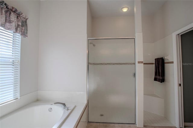 bathroom with plus walk in shower and tile patterned flooring