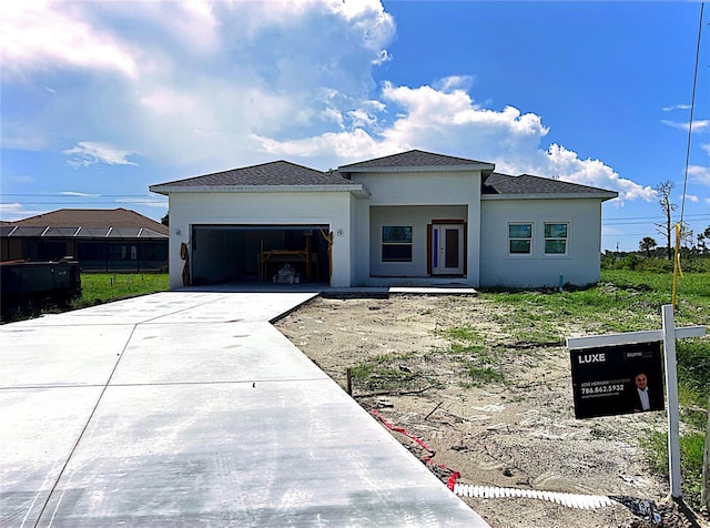 view of front of property featuring a garage