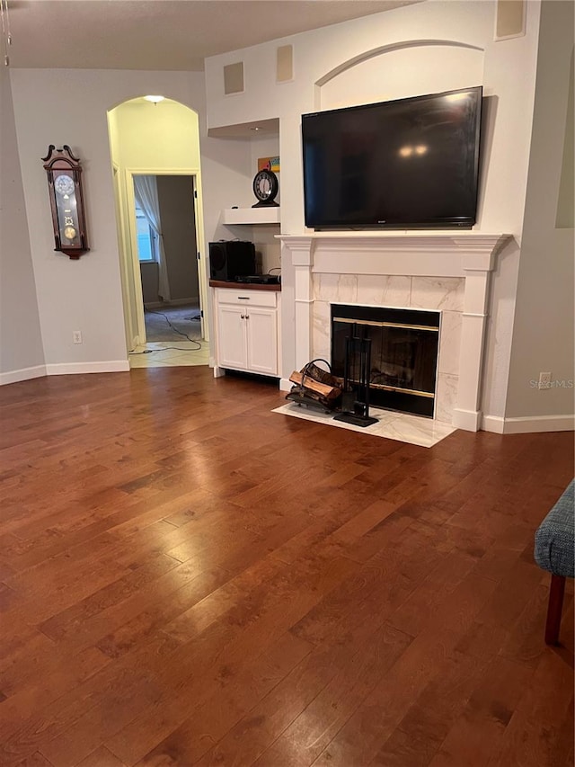 living room featuring a fireplace and dark hardwood / wood-style floors