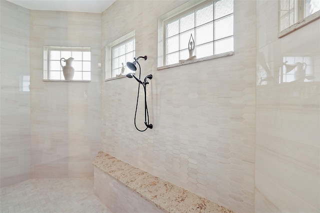 bathroom with a tile shower