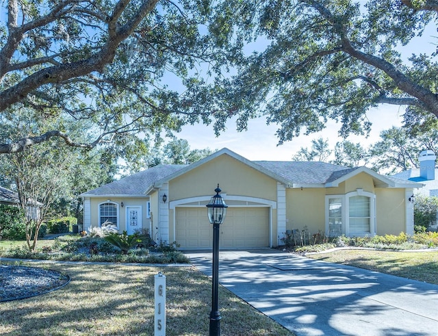 single story home with a front lawn and a garage