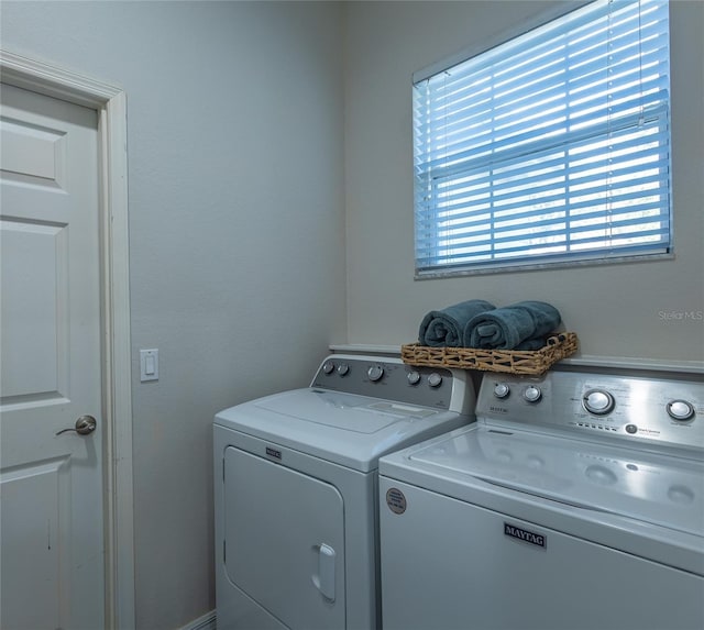 laundry room with washing machine and dryer