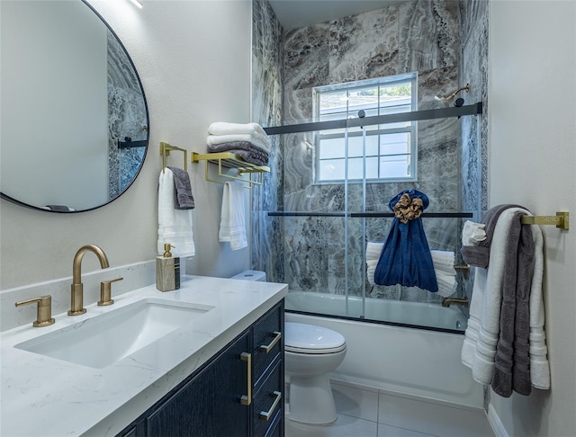 full bathroom featuring shower / bath combination with glass door, vanity, toilet, and tile patterned flooring