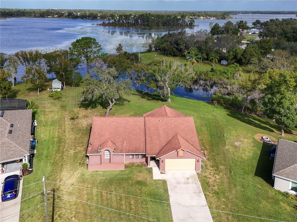 birds eye view of property with a water view