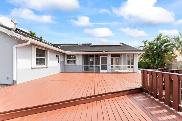 deck with a sunroom