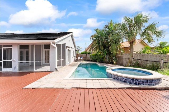 view of pool featuring a wooden deck, an in ground hot tub, and french doors