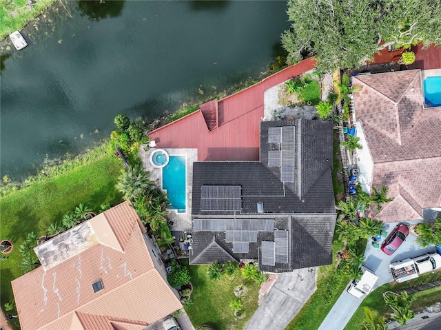 birds eye view of property with a water view