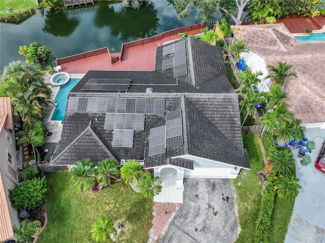 birds eye view of property with a water view