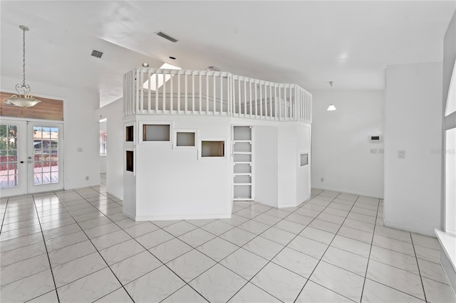 kitchen with french doors, high vaulted ceiling, hanging light fixtures, and light tile patterned floors