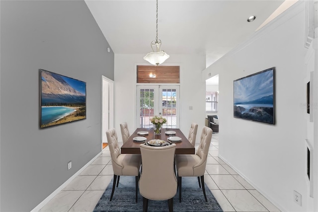 dining space with french doors and light tile patterned flooring