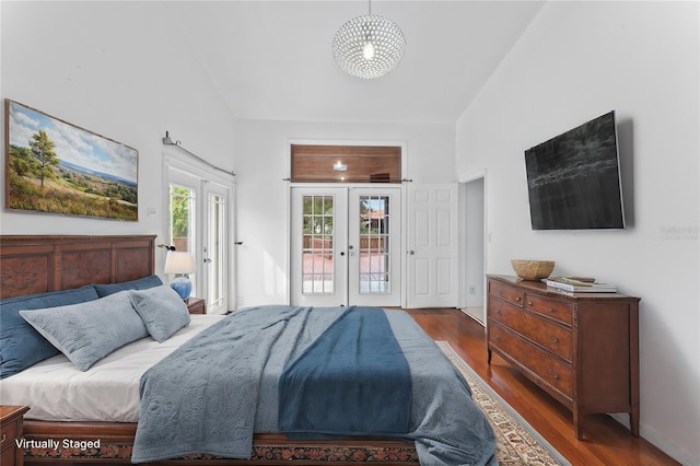 bedroom with french doors, access to exterior, and dark hardwood / wood-style floors