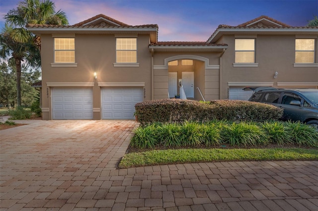 view of front of home with a garage