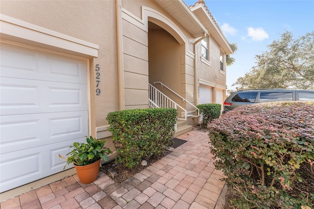 view of side of property with a garage