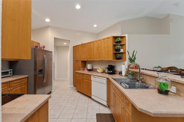 kitchen featuring dishwasher, black electric stovetop, sink, vaulted ceiling, and light tile patterned floors