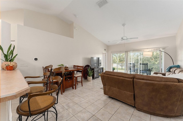 tiled living room with ceiling fan and vaulted ceiling