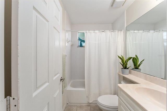 full bathroom featuring vanity, toilet, tile patterned floors, and shower / tub combo