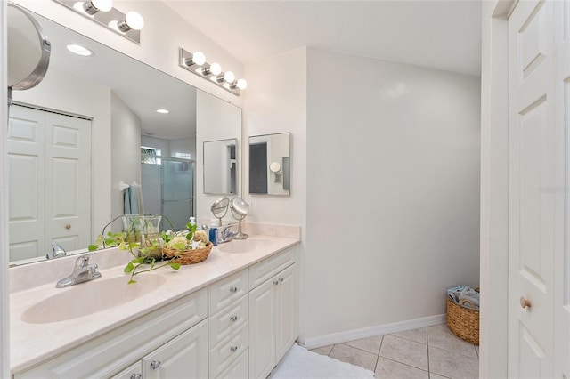 bathroom with vanity, tile patterned floors, and an enclosed shower